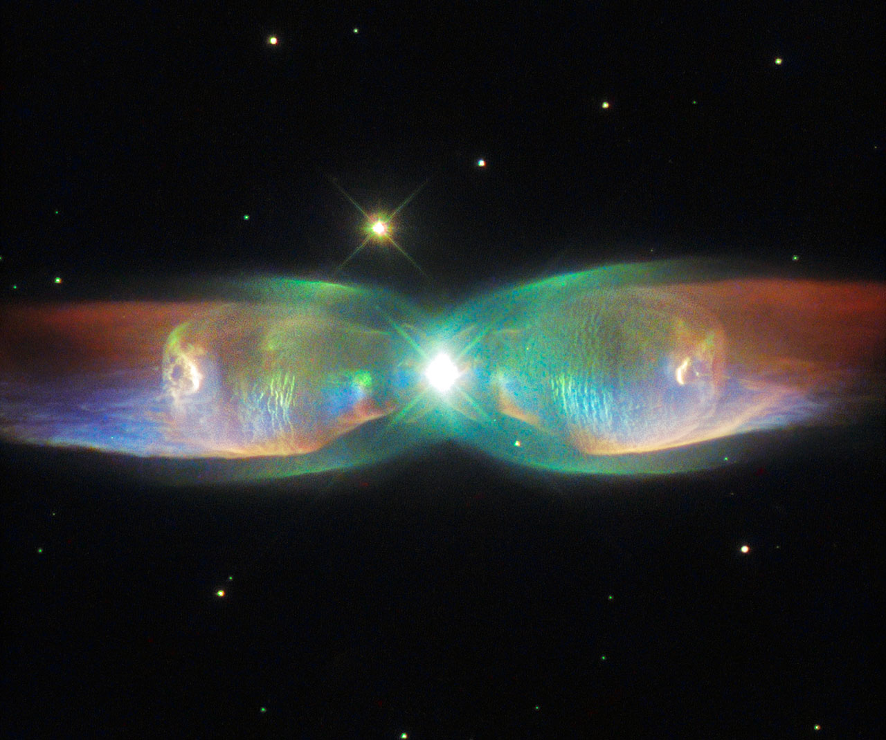 <span style="font-size:16px;position:relative;top:-50px">[Credit: ESA/Hubble & NASA. Acknowledgement: Judy Schmidt](http://sci.esa.int/hubble/56391-the-wings-of-the-butterfly-heic1518/)</span>